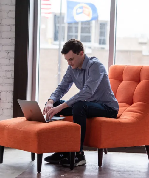 Gabe Conger of Click Control Marketing working on a mac laptop.